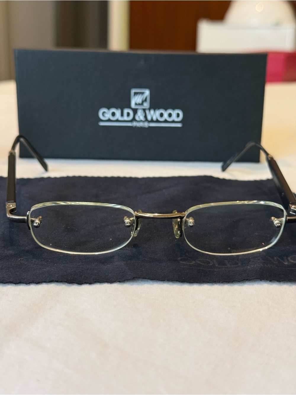 Gold & Wood brand rimless glasses.